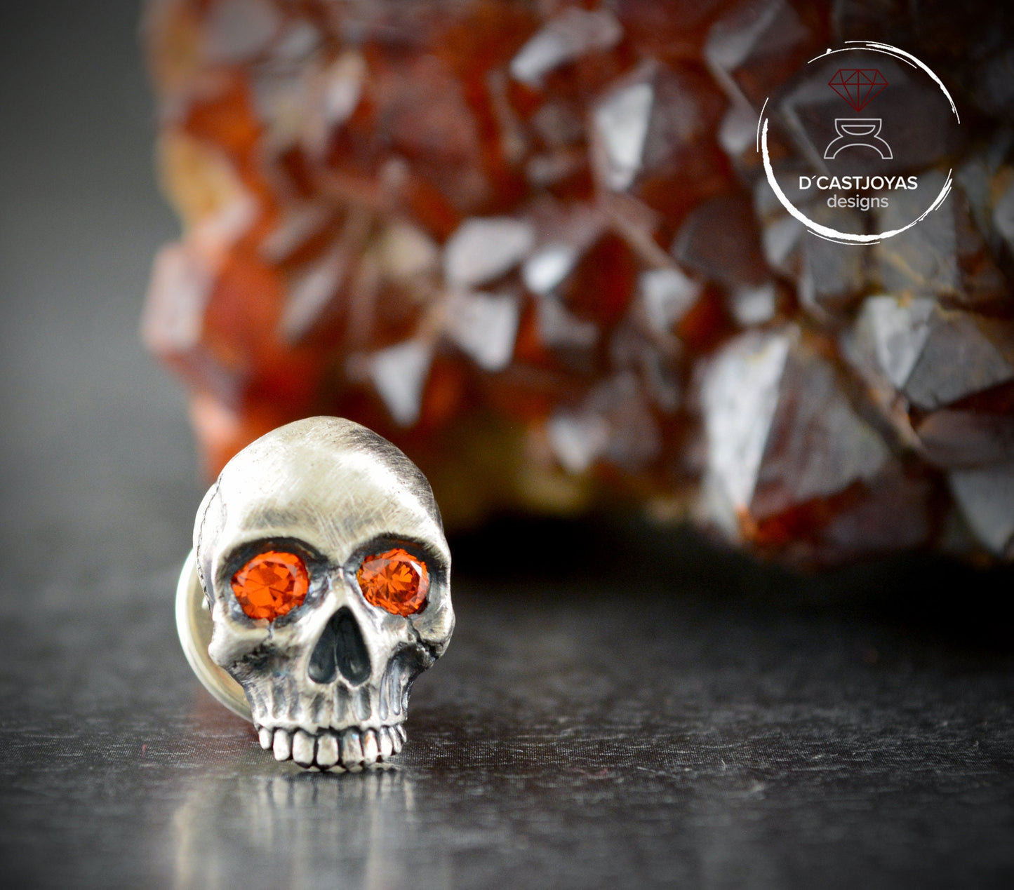 Sterling silver skull pin with natural stones in the eyes