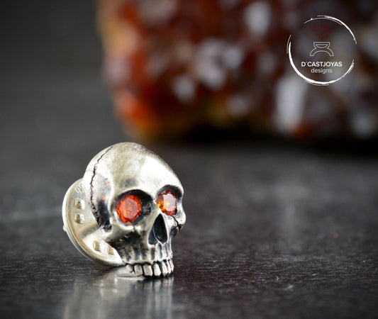 Sterling silver skull pin with natural stones in the eyes